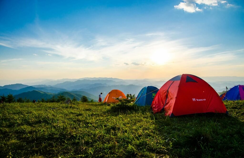 Acampar es para todos! 
Photo of Pitched Dome Tents Overlooking Mountain Ranges